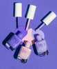 Light pink nail polish, light purple nail polish, and true purple nail polish set. 